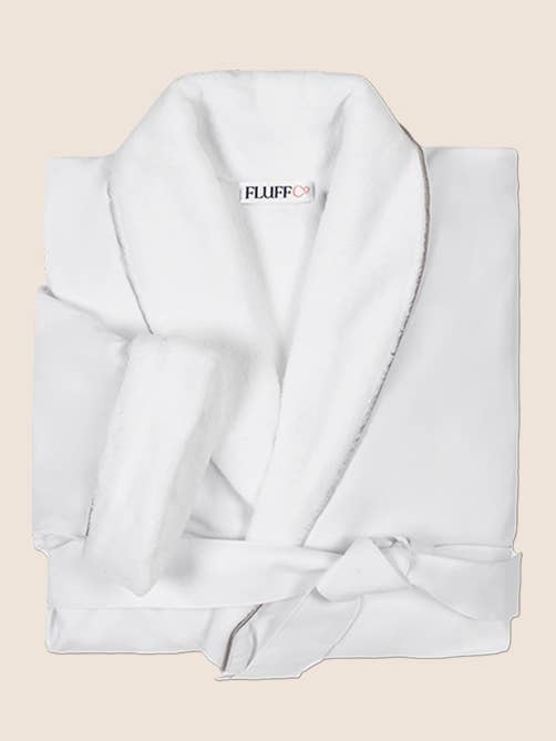 White FluffCo hotel robe with plush collar and subtle grey piping