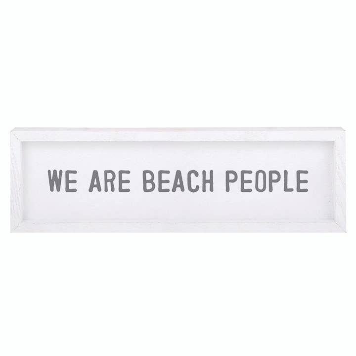 White framed wood sign reading "WE ARE BEACH PEOPLE"