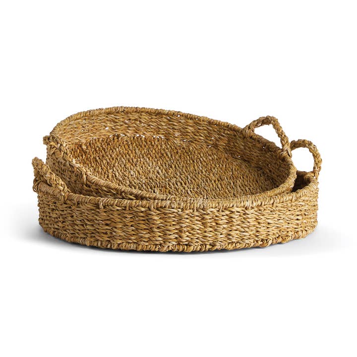 Set of two handwoven natural seagrass round trays with handles