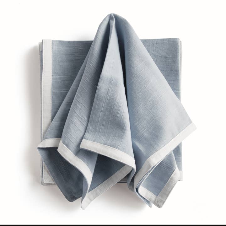 Set of four blue Paige dinner napkins with crisp white border