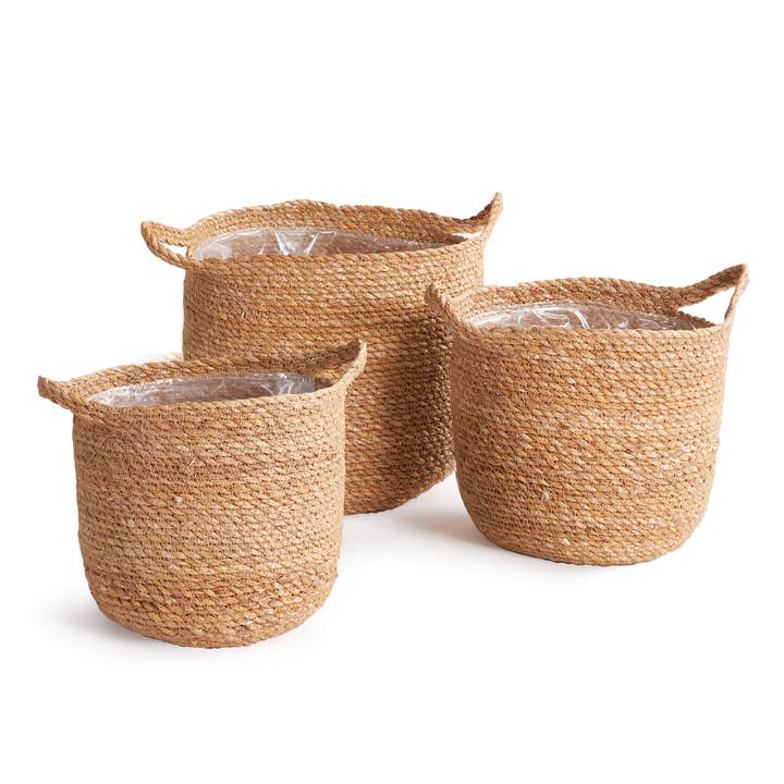 Set of three natural seagrass round baskets with handles
