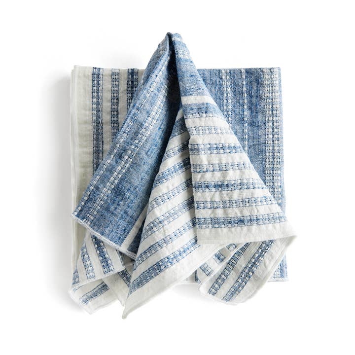 Set of four textured blue and white cotton dinner napkins